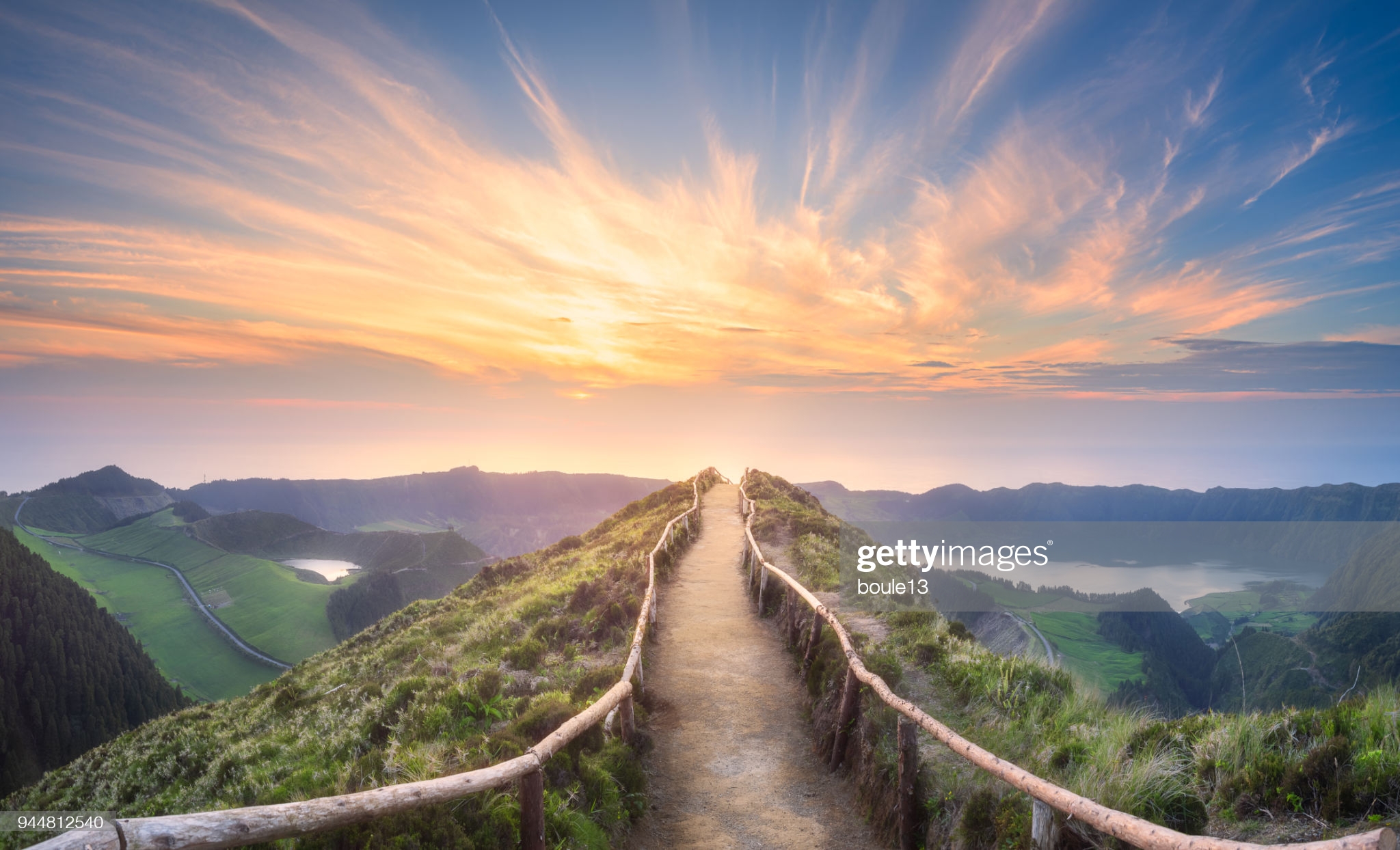 A hilltop path with the sunset in the background