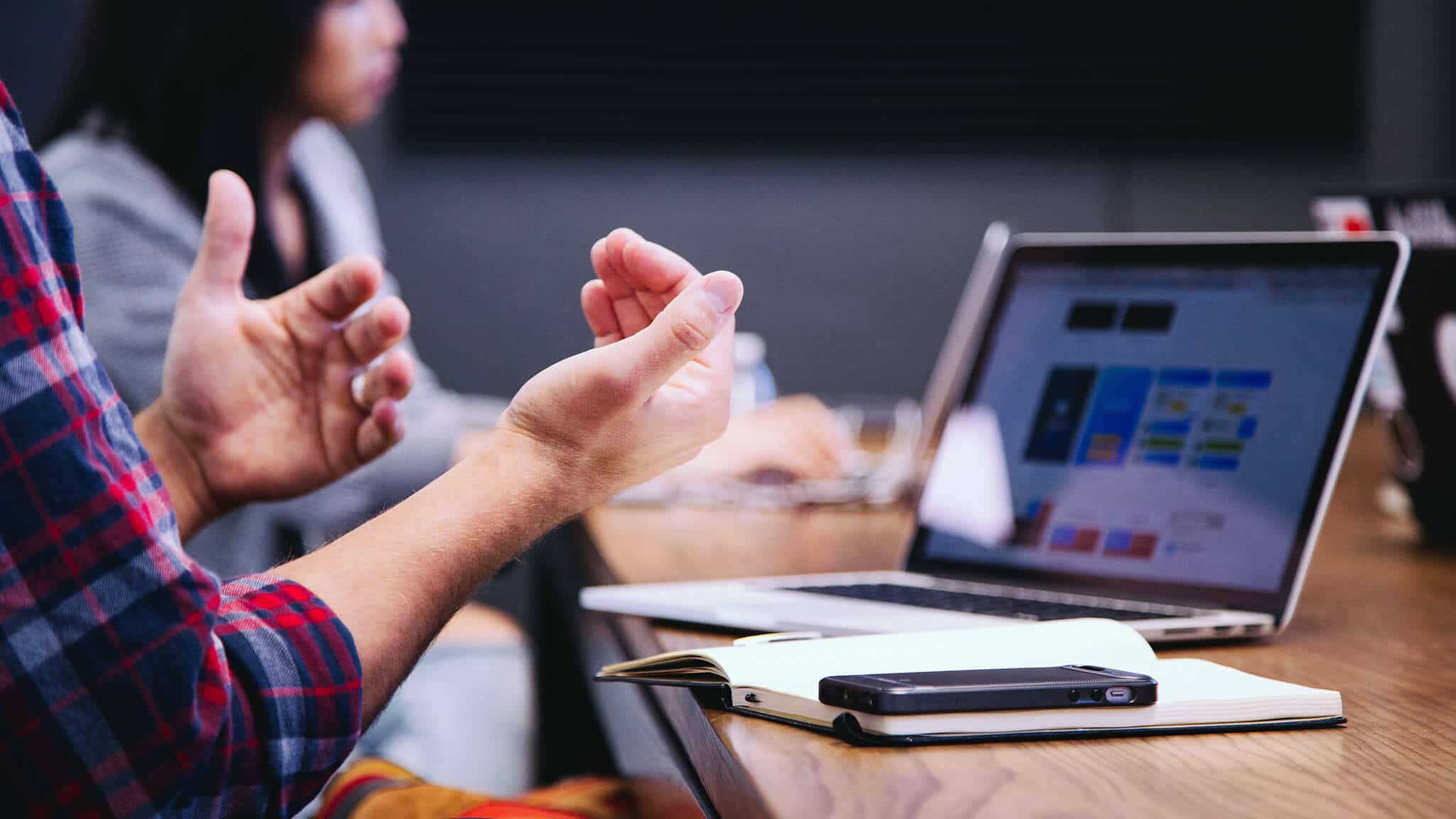 Close up of man&#039;s hands and open laptop screen