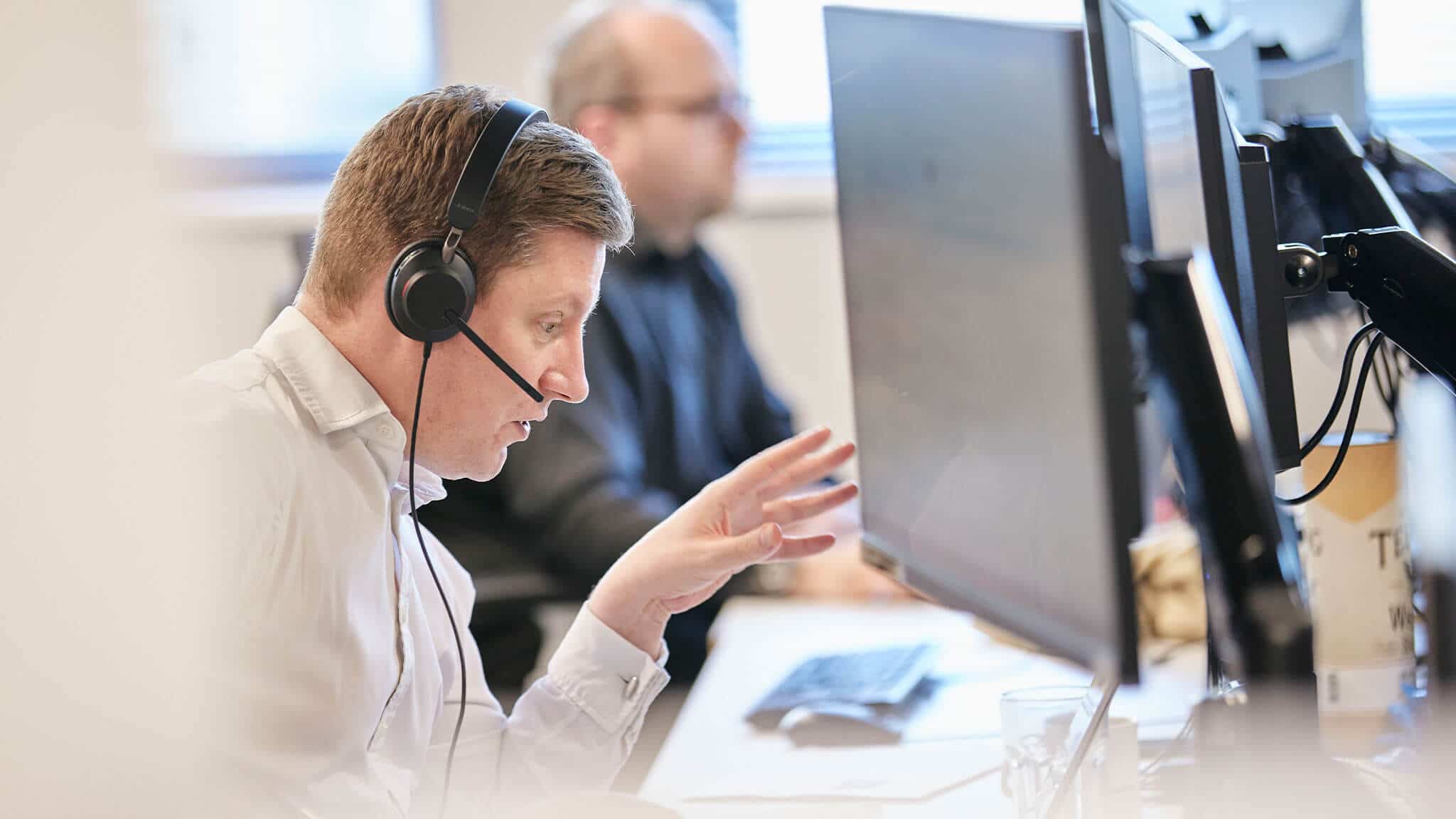 Stuart Browning wearing headset explaining