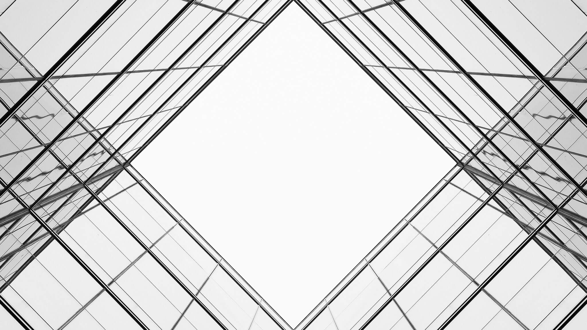 Worm&#039;s eye view shot looking up through glass atrium