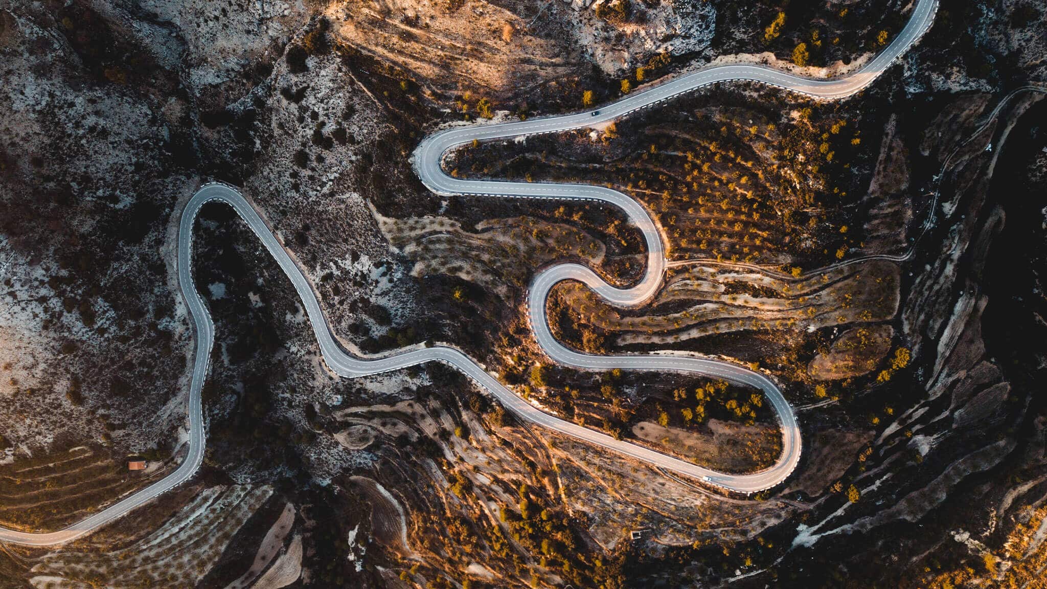 Aerial shot of a winding mountain road
