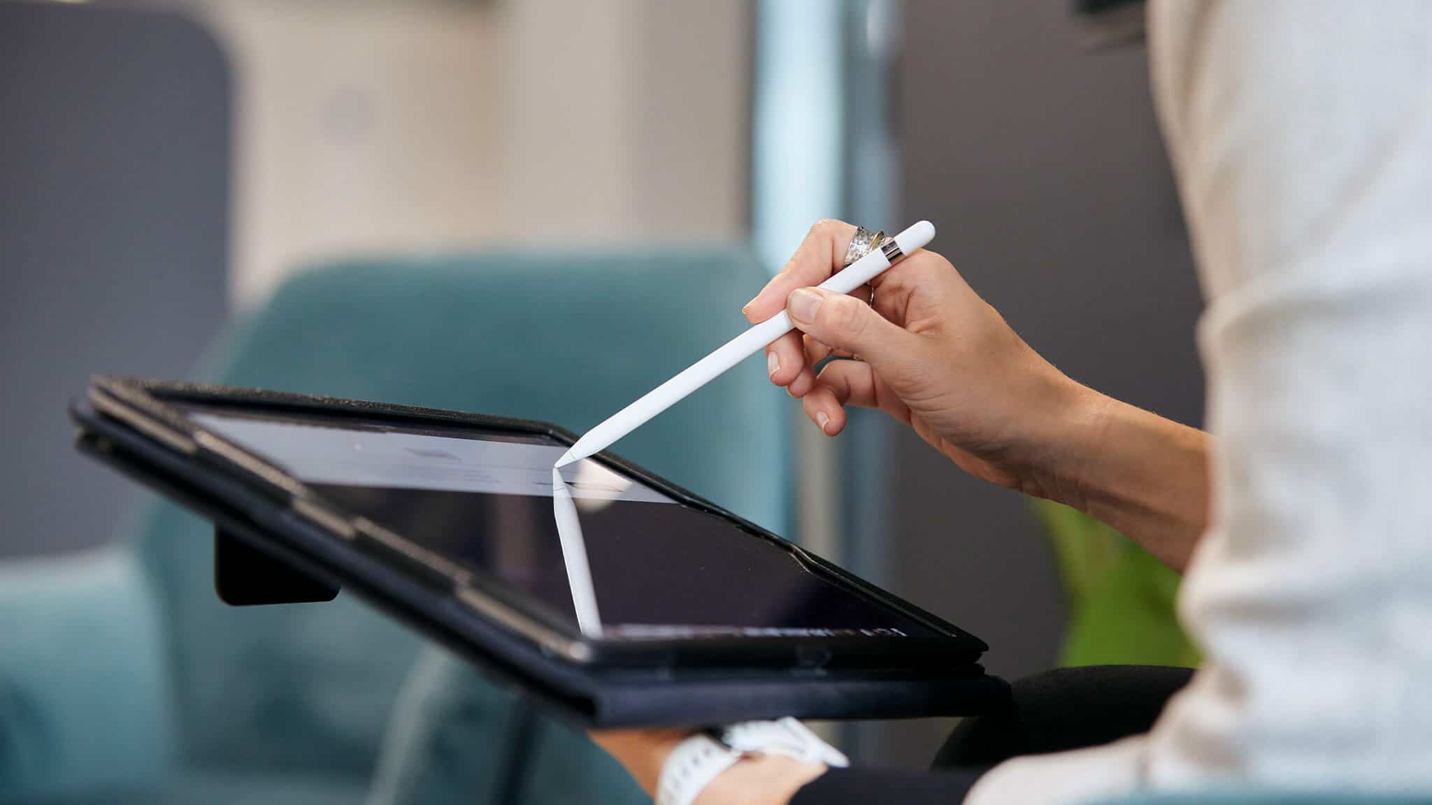 Alternate close up of woman&#039;s hands using stylus and tablet