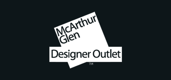 McArthur Glen logo in white on black background